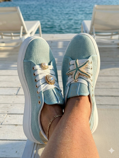 Sneaker gioiello con dettagli in strass e suola alta